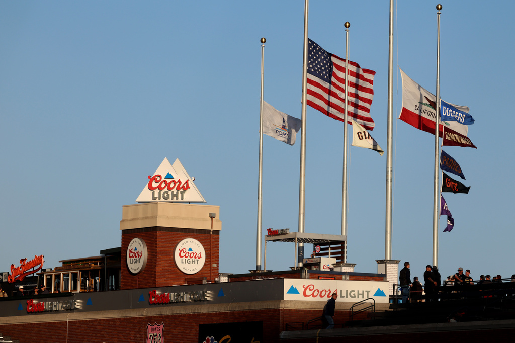 American flags stand at half staff before a baseball game between the San Diego Padres and the San Francisco Giants in San Francisco, Friday, Sept. 11, 2026. (AP Photo/Jed Jacobsohn)