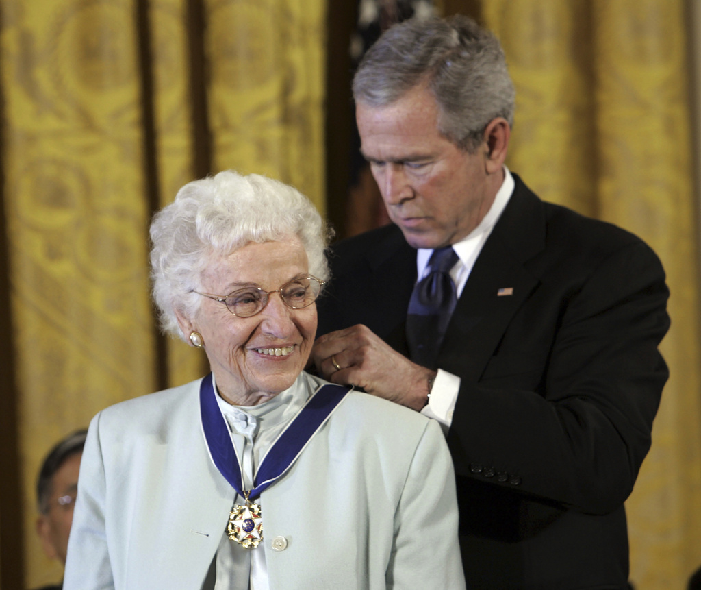 FILE - President George W. Bush, right, bestows the Presidential Medal of Freedom to Ruth Johnson Colvin, from Syracuse, N.Y., during a ceremony in the East Room of the White House in Washington, Dec. 15, 2006. (AP Photo/Pablo Martinez Monsivais, File)
