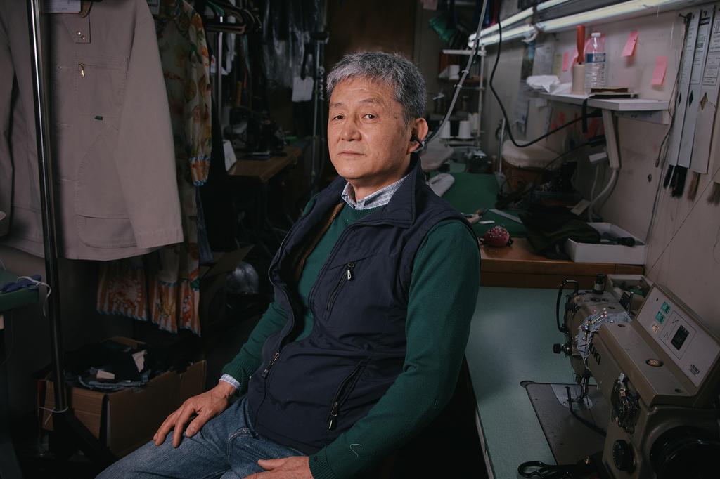 Tailor, Kil Bae, poses for a photo inside his shop on Friday, March 27, 2026, in New York. (AP Photo/Andres Kudacki)