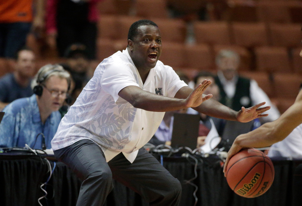 FILE - Hawaii coach Benjy Taylor gestures to his team during the first half of an NCAA college basketball game against UC Davis in the semifinals of the Big West Conference tournament, March 13, 2015, in Anaheim, Calif. (AP Photo/Jae C. Hong, File)