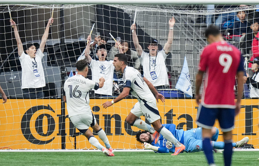 Vancouver Whitecaps' Daniel Rios (14) and Sebastian Berhalter (16) celebrate after Rios' goal against FC Dallas goalkeeper Michael Collodi, bottom right, during the first half in Game 1 in the first round of MLS soccer's Western Conference playoffs in Vancouver, British Columbia, Sunday, Oct. 26, 2025. (Darryl Dyck/The Canadian Press via AP) Vancouver Whitecaps' Daniel Rios (14) and Sebastian Berhalter (16) celebrate after Rios' goal against FC Dallas goalkeeper Michael Collodi, bottom right, during the first half in Game 1 in the first round of MLS soccer's Western Conference playoffs in Vancouver, British Columbia, Sunday, Oct. 26, 2025. (Darryl Dyck/The Canadian Press via AP)