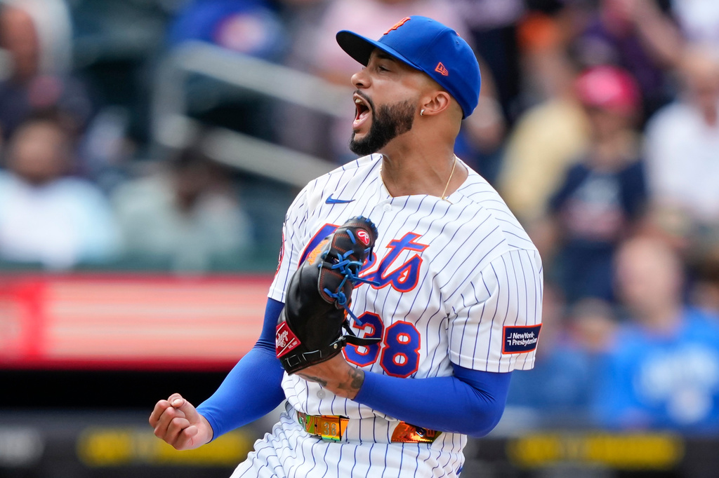 New York Mets pitcher Devin Williams (38) reacts after winning the first baseball game of a doubleheader against the Atlanta Braves, Wednesday, July 29, 2026, in New York. (AP Photo/Yuki Iwamura)