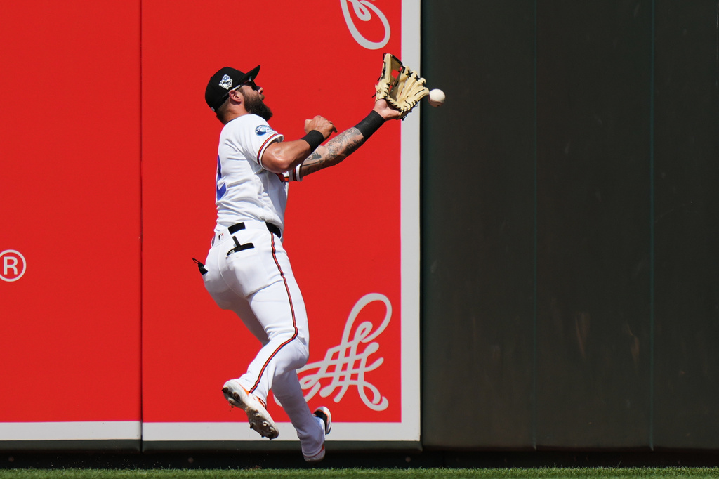 Baltimore Orioles left fielder Weston Wilson is unable to catch a two-run triple hit by Arizona Diamondbacks' Adrian del Castillo during the third inning of a baseball game, Wednesday, April 15, 2026, in Baltimore. (AP Photo/Stephanie Scarbrough)