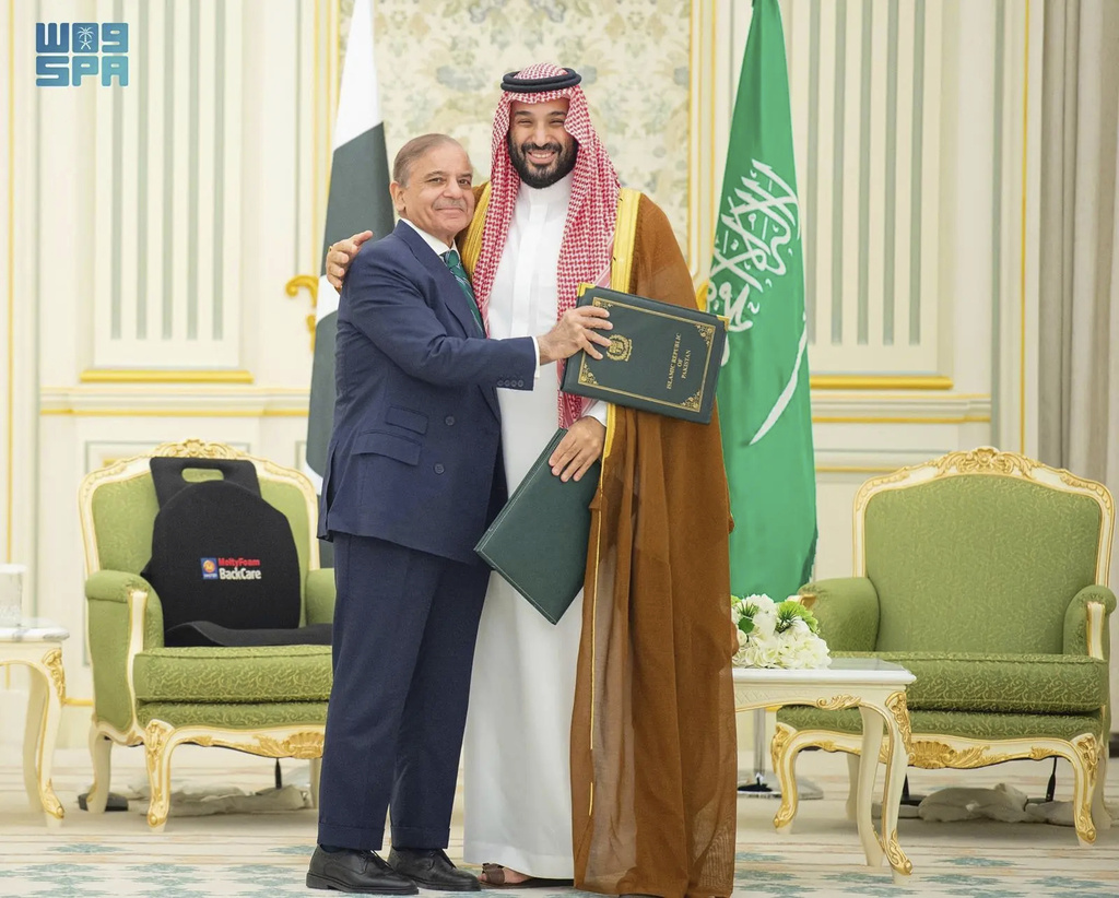 This handout photograph released by the state-run Saudi Press Agency shows Pakistani Prime Minister Shehbaz Sharif, left, embracing Saudi Arabia's Crown Prince Mohammed bin Salman after signing a joint defense pact in Riyadh, Saudi Arabia, Wednesday, Sept. 17, 2025. (Saudi Press Agency via AP)