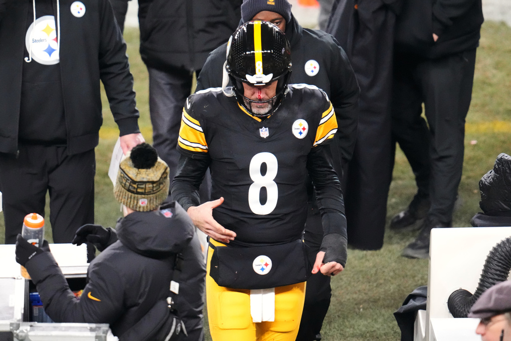 Pittsburgh Steelers quarterback Aaron Rodgers (8) walks to the sideline to be check out for injury during the second half of an NFL football game against the Buffalo Bills Sunday, Nov. 30, 2025, in Pittsburgh. (AP Photo/Gene J. Puskar)