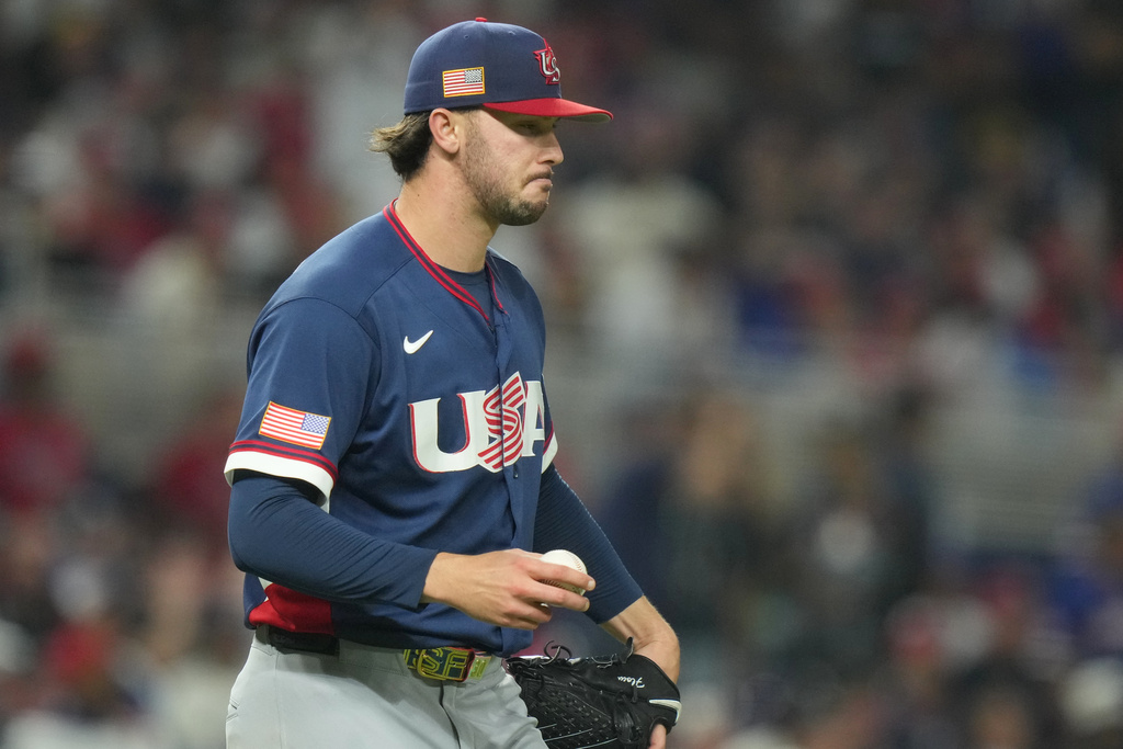 United States pitcher Paul Skenes walks back to the mound during the fourth inning of a World Baseball Classic semifinal game against the Dominican Republic, Sunday, March 15, 2026, in Miami. Skenes flag patch on the hat and sleeve are backwards. (AP Photo/Lynne Sladky)