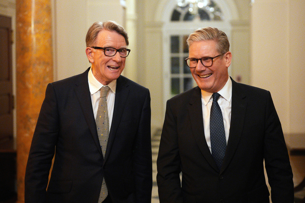 FILE - British Prime Minister Keir Starmer, right, talks with Britain's ambassador to the United States Peter Mandelson during a welcome reception at the ambassador's residence on Wednesday, Feb. 26, 2025 in Washington. (Carl Court/Pool Photo via AP, File)