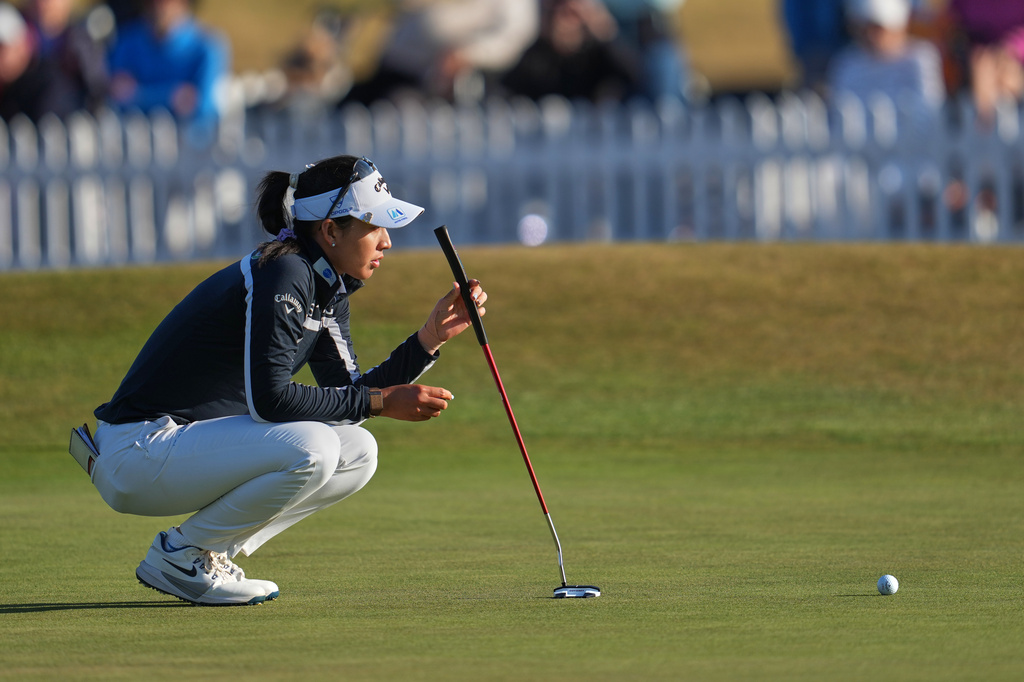Jeeno Thitikul, of Thailand, lines up a putt on the 18th green during the third round of the Women's British Open golf championship in Lytham St Annes, England, Saturday, Aug. 1, 2026. (AP Photo/Jon Super)