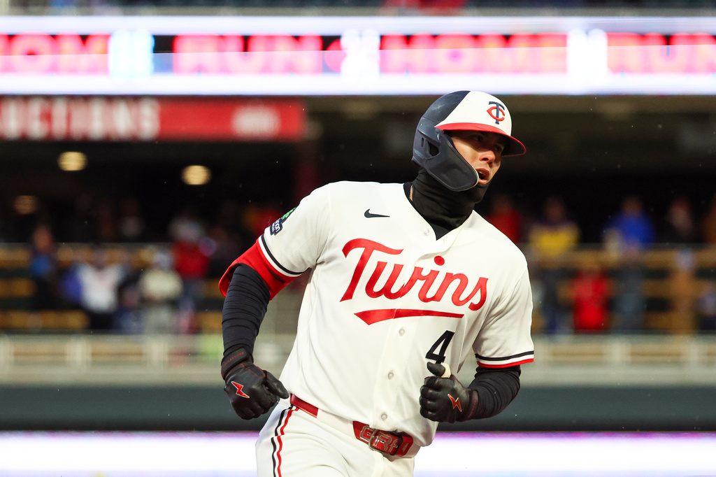 Minnesota Twins' Tristan Gray rounds the bases after hitting a grand slam during the seventh inning of a baseball game against the Tampa Bay Rays, Friday, April 3, 2026, in Minneapolis. (AP Photo/Ellen Schmidt)