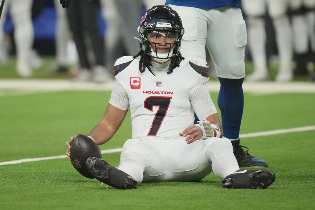 Houston Texans quarterback C.J. Stroud (7) reacts after being sacked by Indianapolis Colts' Chris Wormley during the first half of an NFL football game Sunday, Nov. 30, 2025, in Indianapolis. (AP Photo/AJ Mast)