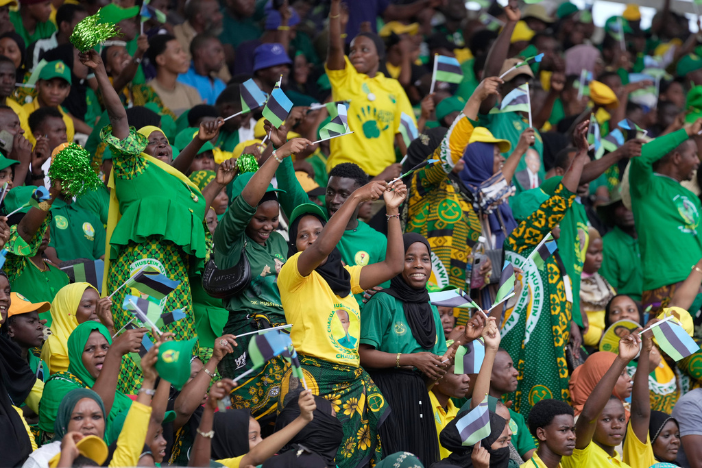 Supporters of the ruling Chama Cha Mapinduzi (Revolutionary Party) sing during the inauguration of Zanzibar President elect Hussein Ali Mwinyi at Amaan Stadium in Zanzibar, Tanzania, Saturday, Nov. 1, 2025. (AP Photo/Brian Inganga)