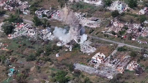 In this image made from video provided by Russian Defense Ministry Press Service on Tuesday, Oct. 28, 2025, a shell explodes in a village after a Russian gun is fired, on an undisclosed location in Ukraine. (Russian Defense Ministry Press Service via AP) In this image made from video provided by Russian Defense Ministry Press Service on Tuesday, Oct. 28, 2025, a shell explodes in a village after a Russian gun is fired, on an undisclosed location in Ukraine. (Russian Defense Ministry Press Service via AP)