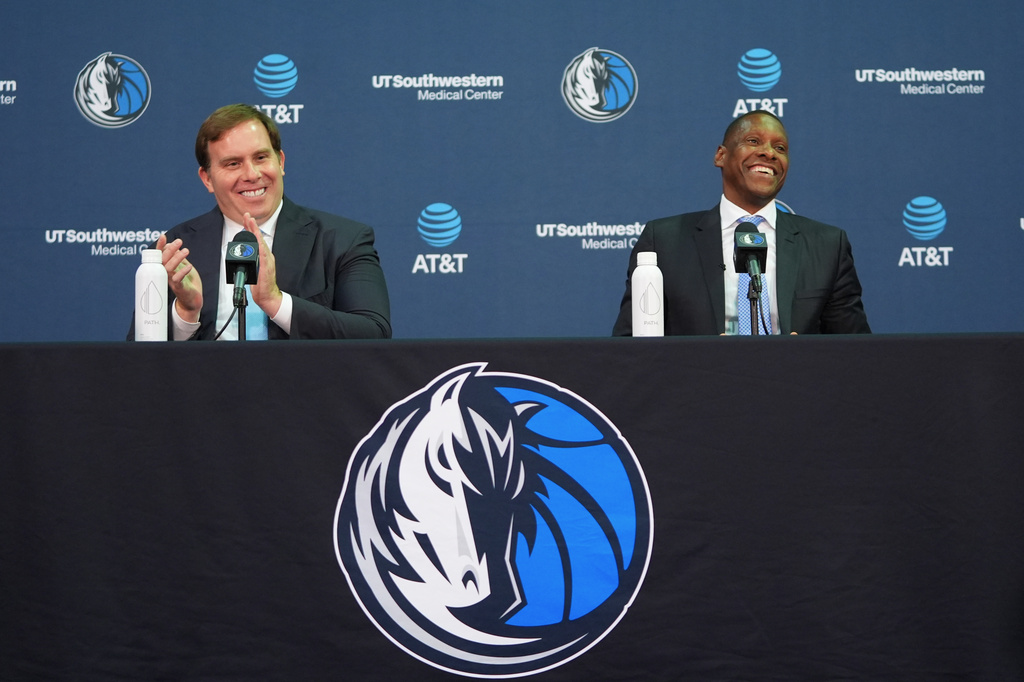 Dallas Mavericks' new team president Masai Ujiri, right, laughs as team governor Patrick Dumont claps during an introductory NBA basketball news conference in Dallas, Tuesday, May 5, 2026. (AP Photo/LM Otero)