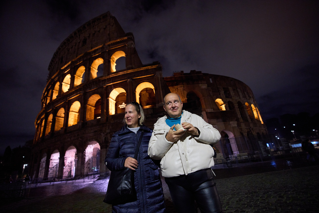 Michela Marcato, left, who is blind, and her partially sighted partner Massimiliano Naccarato pose for a photo during a visit to the Colosseum in Rome, Wednesday, Dec. 17, 2025. (AP Photo/Alessandra Tarantino)