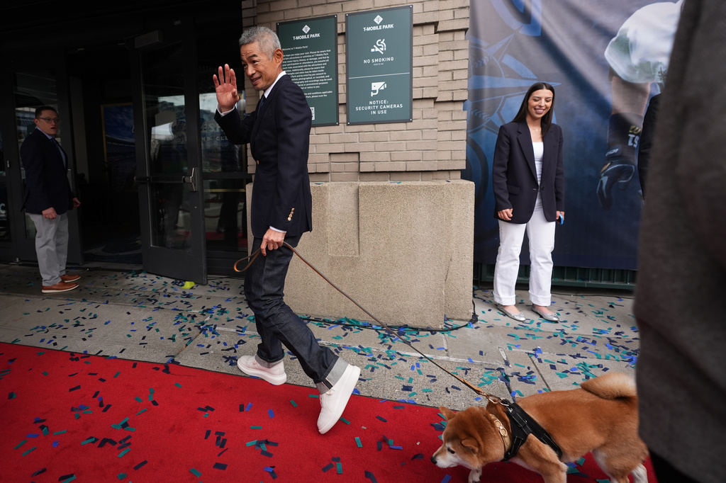 Former Seattle Mariners right fielder Ichiro Suzuki departs with his dog Kikyu after the unveiling ceremony for his statue outside of T-Mobile Park, Friday, April 10, 2026, in Seattle. (AP Photo/Lindsey Wasson)