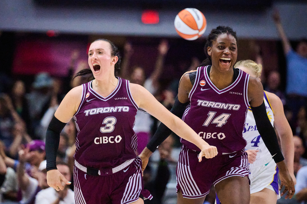 Toronto Tempo's Marina Mabrey (3) celebrates alongside Temi Fagbenle (14) after scoring against the Los Angeles Sparks during the second half of a WNBA basketball game in Toronto, Thursday, June 25, 2026. (Sammy Kogan/The Canadian Press via AP)