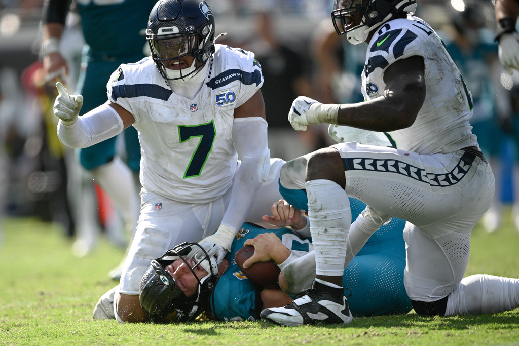 Seattle Seahawks linebacker Uchenna Nwosu (7) celebrates after sacking Jacksonville Jaguars quarterback Trevor Lawrence during the second half of an NFL football game Sunday, Oct. 12 2025, in Jacksonville, Fla. (AP Photo/Phelan M. Ebenhack)