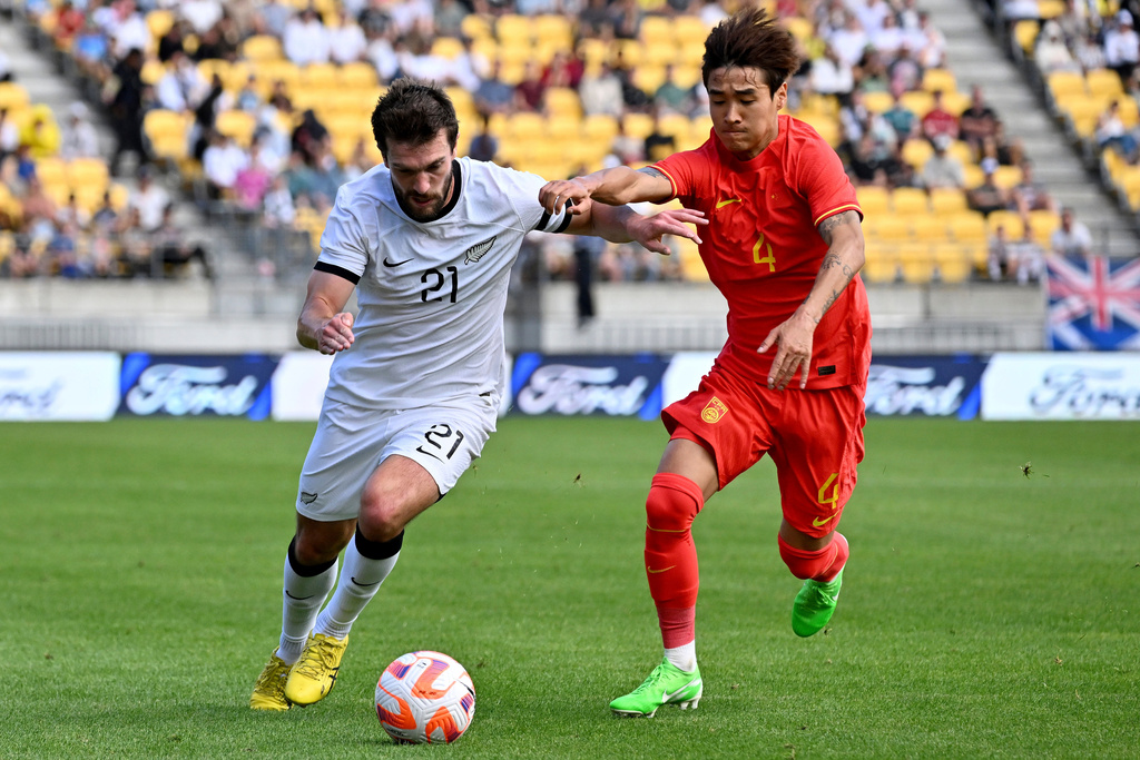 FILE - Tim Payne, left, of the All Whites and Shihao Wei of China compete for the ball during the international soccer friendly between New Zealand and China in Wellington, New Zealand, Sunday, March 26, 2023. (Masanori Udagawa/Photosport via AP,File)
