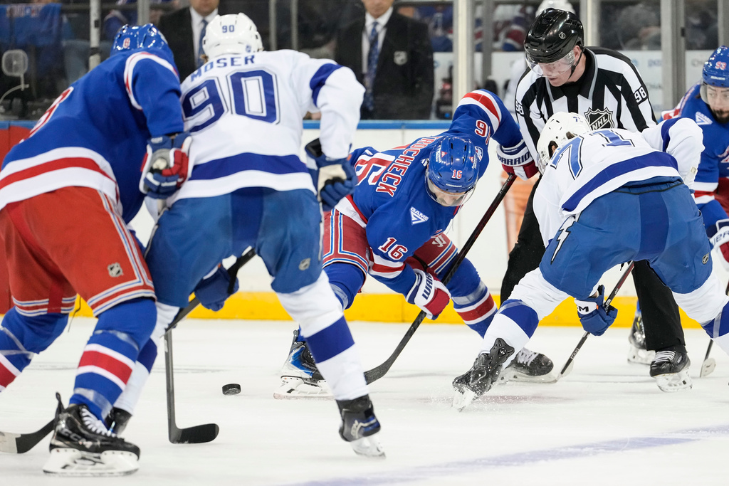 New York Rangers center Vincent Trocheck (16) fights for control of the puck with Tampa Bay Lightning center Anthony Cirelli (71) during the first period of an NHL hockey game, Saturday, Nov. 29, 2025, in New York. (AP Photo/Yuki Iwamura)