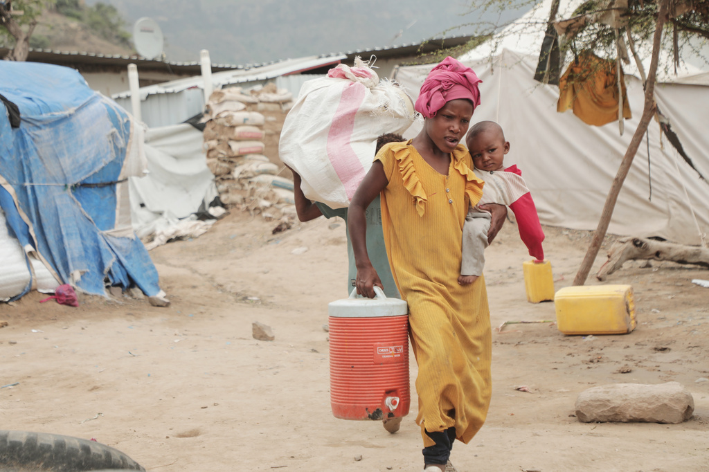 A displaced person walks through a camp in Taiz province, Yemen, Tuesday, Sept. 15, 2026. (AP Photo/Marzouq Al Jabri)