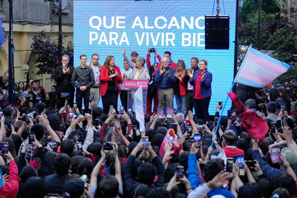 Presidential candidate Jeannette Jara, of the ruling Unity for Chile coalition, addresses supporters after conceding to Jose Antonio Kast, of the opposition Republican Party, in the presidential runoff election in Santiago, Chile, Sunday, Dec. 14, 2025. (AP Photo/Natacha Pisarenko)