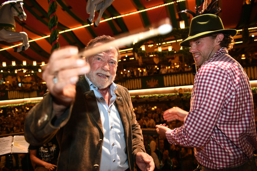 Arnold Schwarzenegger and his son, Christopher Schwarzenegger, stand on stage during the 190th Oktoberfest on Friday, Sept. 26, 2025, in Munich, Germany. (Felix Hörhager/dpa via AP) Arnold Schwarzenegger and his son, Christopher Schwarzenegger, stand on stage during the 190th Oktoberfest on Friday, Sept. 26, 2025, in Munich, Germany. (Felix Hörhager/dpa via AP)