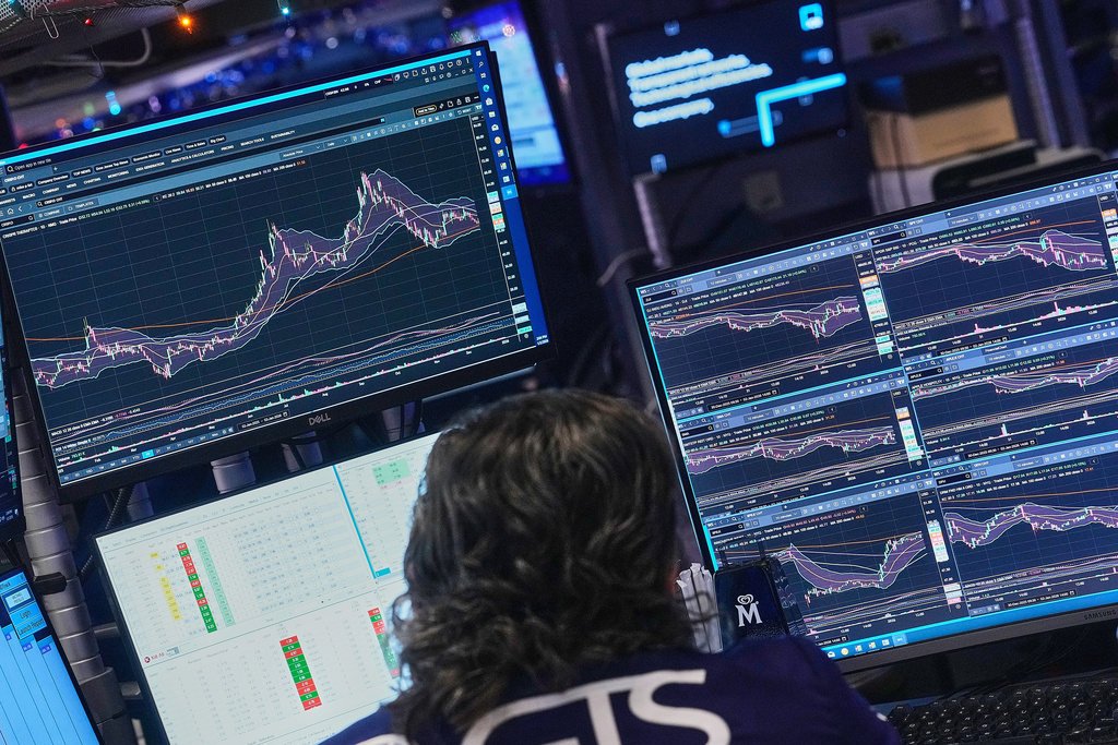 Specialist Michael Pistillo works at his post on the floor of the New York Stock Exchange, Friday, Jan. 2, 2026. (AP Photo/Richard Drew)