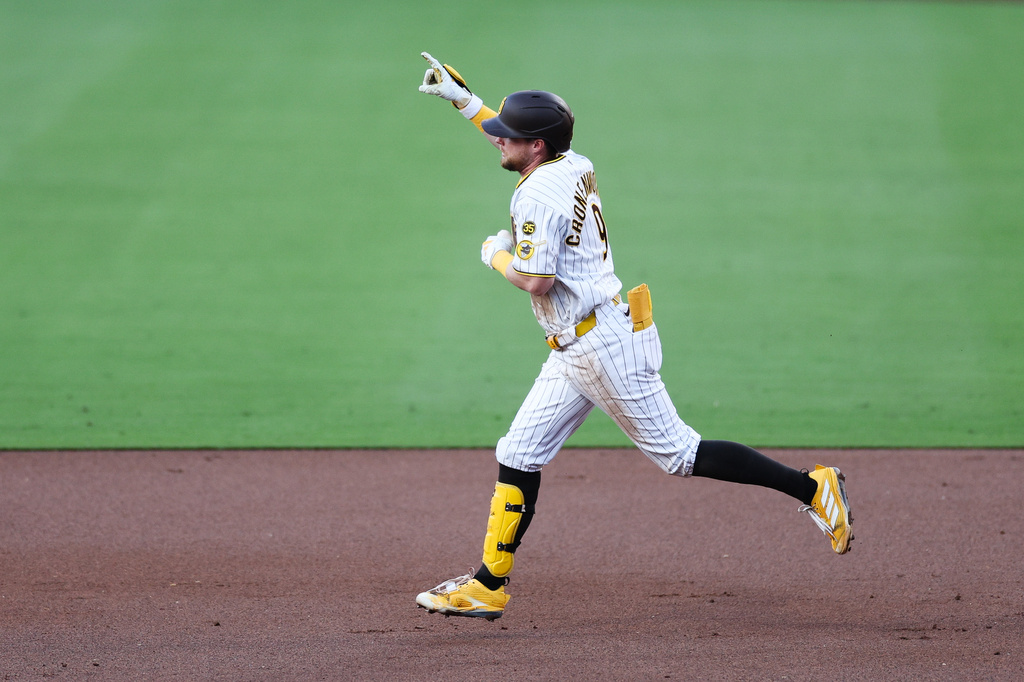 San Diego Padres' Jake Cronenworth gestures to the sky while running the bases after hitting a three-run home run against the Arizona Diamondbacks in the first inning of a baseball game Tuesday, July 7, 2026, in San Diego. (AP Photo/Derrick Tuskan)