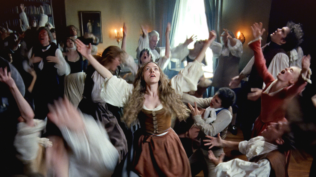 This image released by Searchlight Pictures shows Amanda Seyfried, center, in a scene from "The Testament of Ann Lee." (Searchlight Pictures via AP)