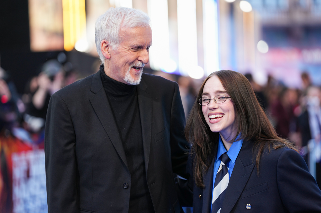 James Cameron, left, and Billie Eilish pose for photographers upon arrival a the screening of the film 'Hit me Hard and Soft: The Tour' on Tuesday, April 28, 2026, in London. (Photo by Scott A Garfitt/Invision/AP)