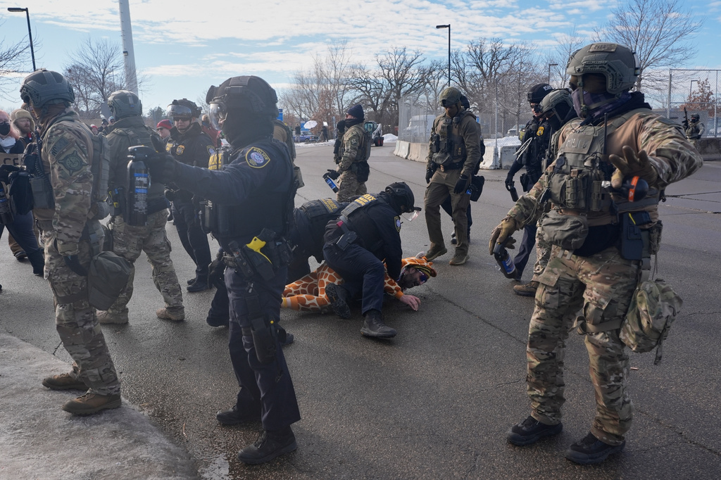 FILE - Protesters demonstrate against Immigration and Customs Enforcement (ICE) after Renee Good, who was fatally shot by an ICE officer earlier, Jan. 12, 2026, in Minneapolis. (AP Photo/Jen Golbeck, File)