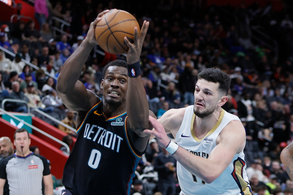 Detroit Pistons center Jalen Duren (0) goes to the basket against New Orleans Pelicans forward Karlo Matkovic (17) during the first half of an NBA basketball game Thursday, March 26, 2026, in Detroit. (AP Photo/Duane Burleson)
