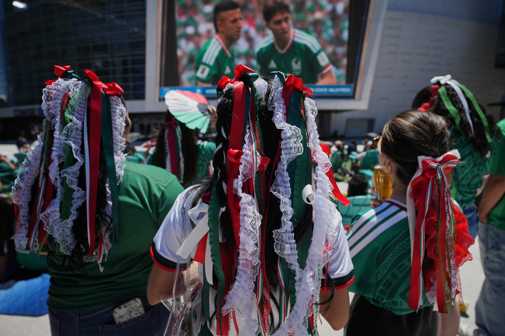Mexico fans watch a public viewing of the opening match of the World Cup soccer tournament between Mexico and South Africa in San Francisco, Thursday, June 11, 2026. (AP Photo/Eugene Hoshiko)