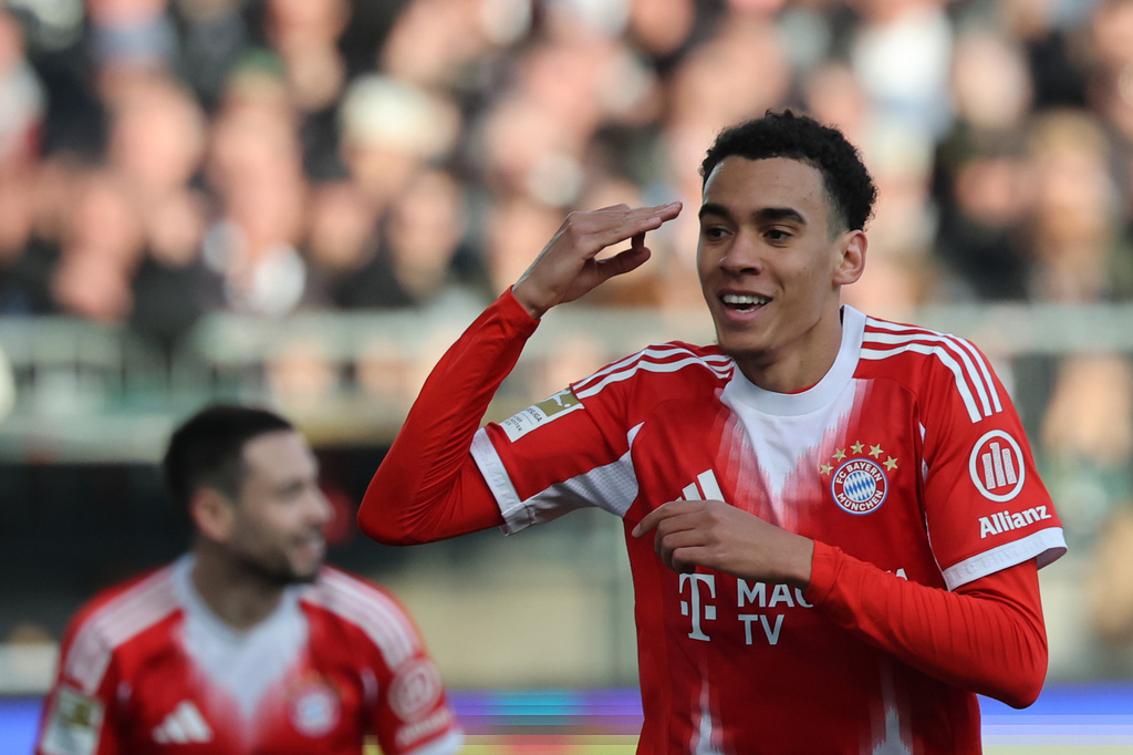Bayern's Jamal Musiala celebrates after scoring during the German Bundesliga soccer match between FC St. Pauli and Bayern Munich in Hamburg, Germany, Saturday, April 11, 2026. (Christian Charisius/dpa via AP)