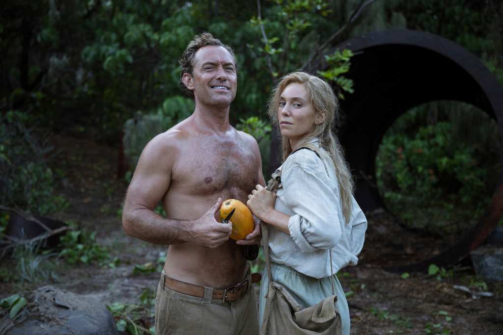 This image released by Vertical Entertainment shows Jude Law, left, and Vanessa Kirby in a scene from "Eden." (Jasin Boland/Vertical Entertainment via AP)