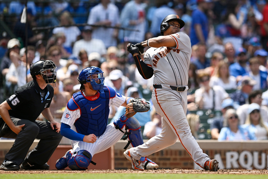 San Francisco Giants' Rafael Devers hits a solo home run during the sixth inning of a baseball game against the Chicago Cubs in Chicago, Saturday, June 6, 2026. (AP Photo/Paul Beaty)