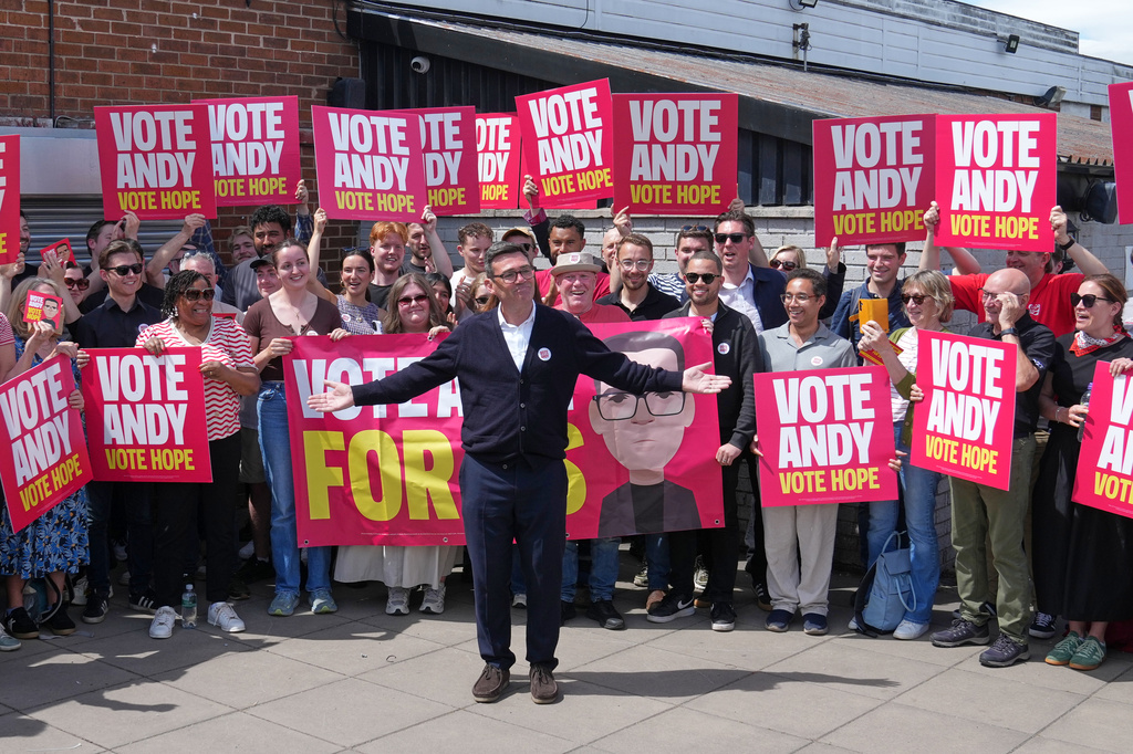 Britain's Labour candidate Andy Burnham stands in front of supporters during the by-election in Makerfield, England, Thursday, June 18, 2026 where voters are choosing a new lawmaker with Andy Burnham of the Labour Party as the leading contender.(AP Photo/Jon Super)