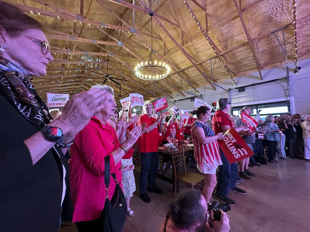 Supporters applaud at a U.S. Senate campaign event for Republican U.S. Rep. Mike Collins in Jackson, Ga. (AP Photo/Jeff Amy)