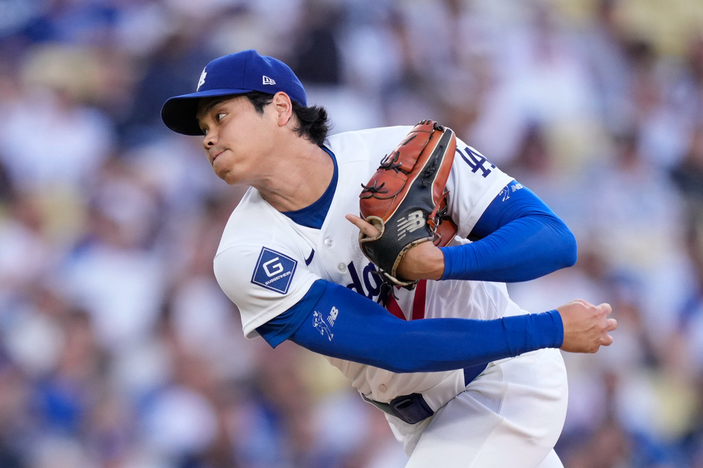 Los Angeles Dodgers starting pitcher Shohei Ohtani throws to the plate during the first inning of a baseball game against the San Diego Padres, Friday, July 3, 2026, in Los Angeles. (AP Photo/Mark J. Terrill)
