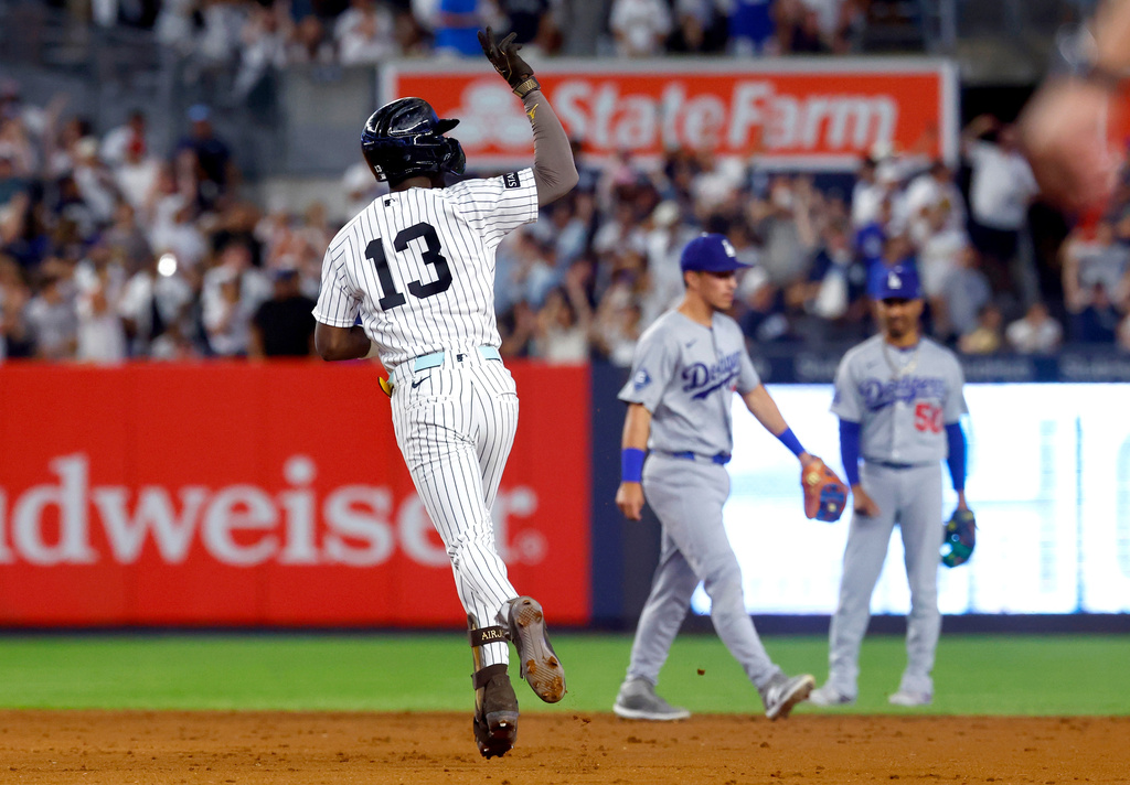 New York Yankees' Jazz Chisholm Jr. reacts running the base after hitting a home run against the Los Angeles Dodgers during the eighth inning of the second game of a baseball doubleheader, Sunday, July 19, 2026 in New York. (AP Photo/Noah K. Murray)