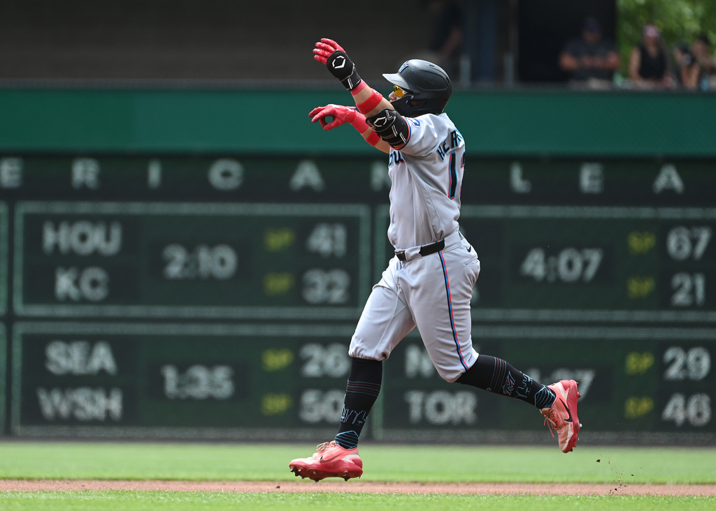 Miami Marlins left fielder Heriberto Hernandez (13) celebrates a solo home run hit off of Pittsburgh Pirates starting pitcher Paul Skenes during the second inning of a baseball game, Sunday, June 14, 2026, in Pittsburgh. (AP Photo/Philip G. Pavely)