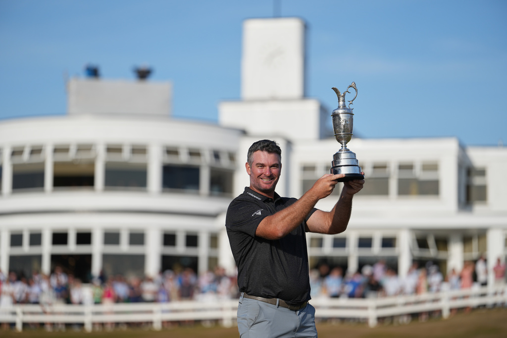 Ryan Fox of New Zealand poses with the Claret Jug trophy in front of the club house, after winning the British Open Golf championships at Royal Birkdale golf club, in Southport, England, Sunday, July 19, 2026. (AP Photo/Jon Super)