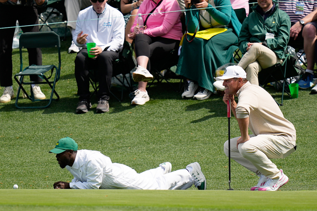 Actor Kevin Hart, left, and Bryson DeChambeau line up a putt during par-3 contest ahead of the Masters golf tournament at the Augusta National Golf Club, Wednesday, April 8, 2026, in Augusta, Ga. (AP Photo/Ashley Landis)