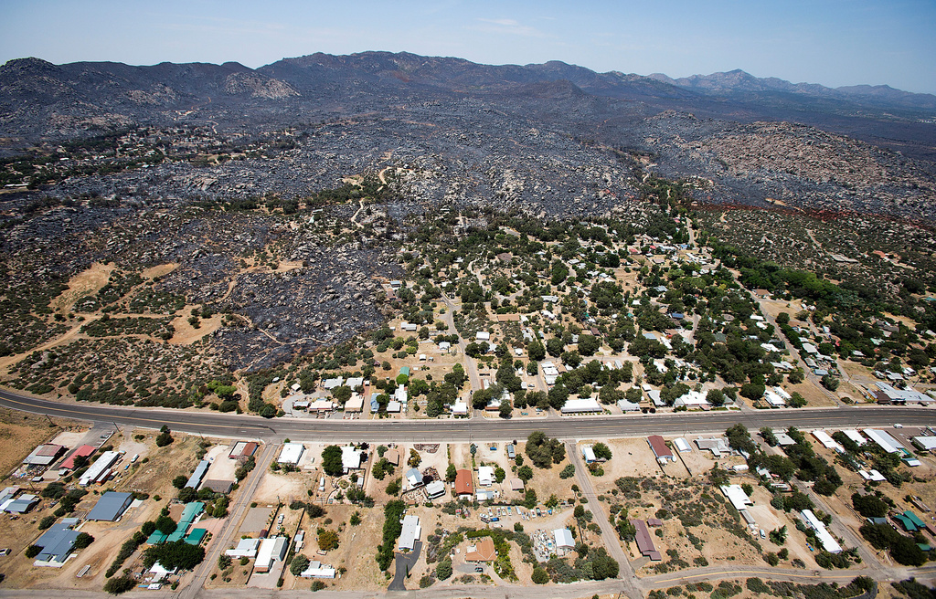File - This July 3, 2013 aerial file photo shows Yarnell, Ariz. in the aftermath of the Yarnell Hill Fire. (AP Photo/Tom Tingle, File)