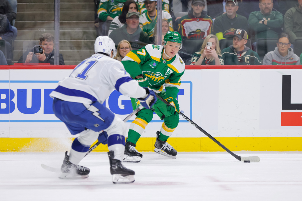 Minnesota Wild left wing Kirill Kaprizov (97) skates with the puck while Tampa Bay Lightning center Anthony Cirelli (71) during the first period of an NHL hockey game, Tuesday, March 3, 2026, in St. Paul, Minn. (AP Photo/Bailey Hillesheim)