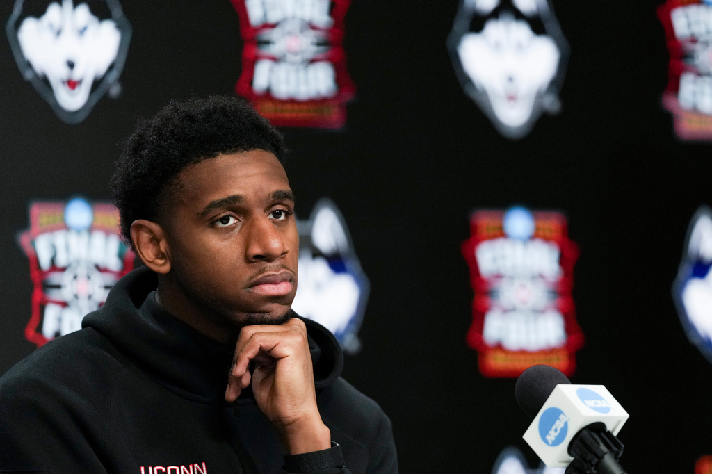 UConn forward Tarris Reed Jr. listens during a news conference ahead of a national championship NCAA college basketball tournament game against Michigan at the Final Four, Sunday, April 5, 2026, in Indianapolis. (AP Photo/Jeff Roberson)