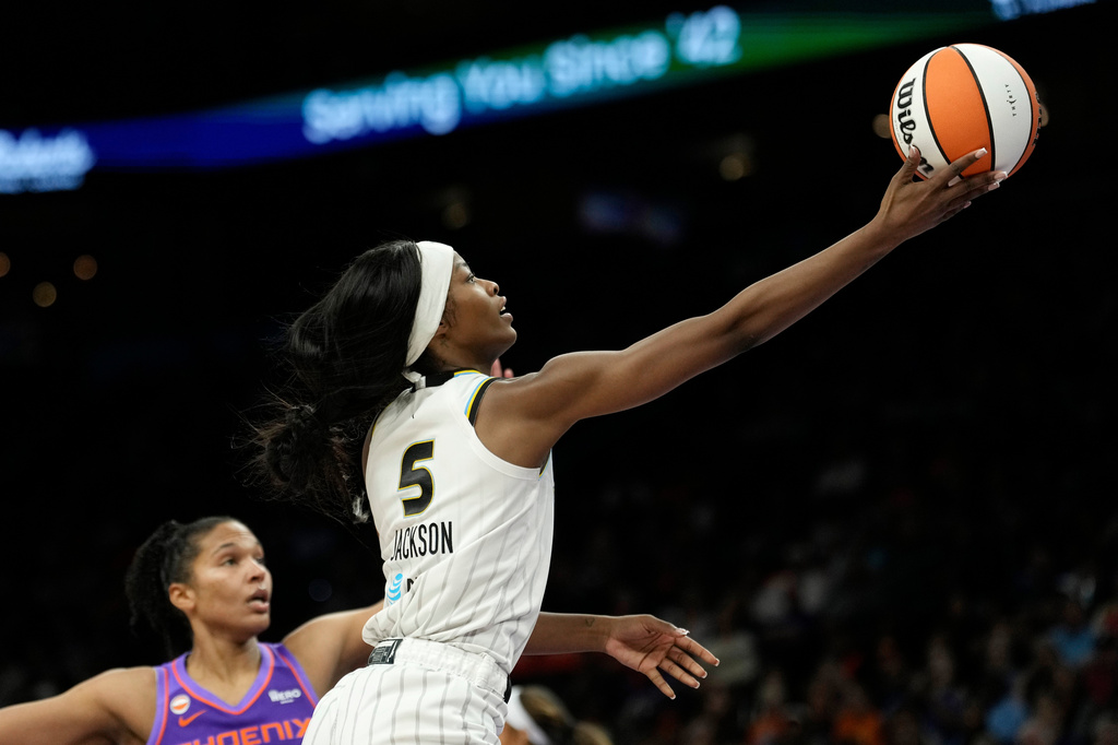 Chicago Sky forward Rickea Jackson (5) drives past Phoenix Mercury forward Alyssa Thomas to score during the second half of a WNBA basketball game, Friday, May 15, 2026, in Phoenix. (AP Photo/Ross D. Franklin)
