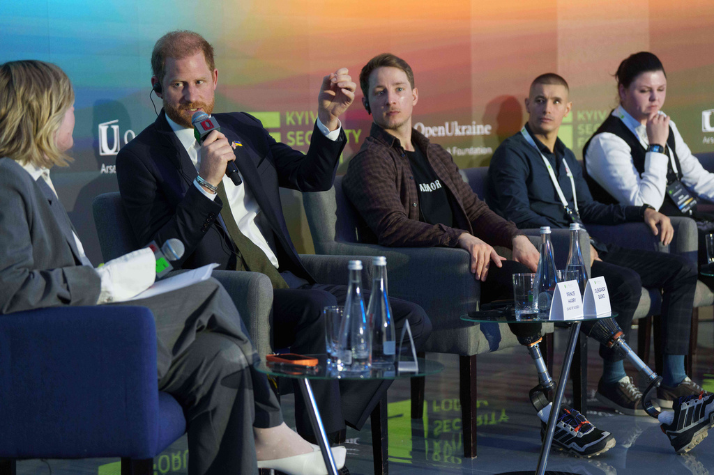 Britain's Prince Harry, second from left, speaks during a discussion together with Ukrainian war veterans at the Security Forum in Kyiv, Ukraine, on Thursday, April 23, 2026. (AP Photo/Evgeniy Maloletka)