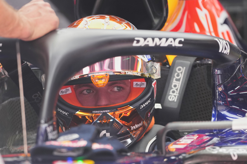 Red Bull driver Max Verstappen, of the Netherlands, sits on his car at pit during the second practice session ahead of Sunday's Formula One Hungarian Grand Prix auto race, at the Hungaroring racetrack in Mogyorod, near Budapest, Hungary, Friday, July 24, 2026. (AP Photo/Darko Vojinovic)