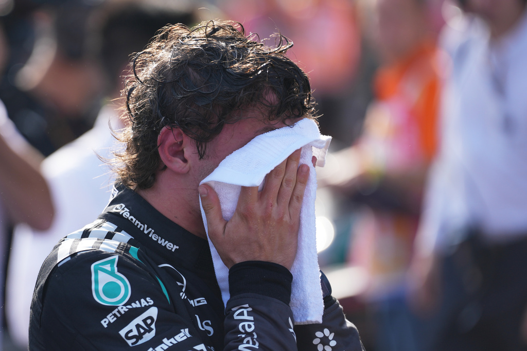 Third placed Mercedes driver Andrea Kimi Antonelli of Italy wipes his face after the Formula One Hungarian Grand Prix auto race, at the Hungaroring racetrack in Mogyorod, near Budapest, Hungary, Sunday, July 26, 2026. (AP Photo/Darko Vojinovic)